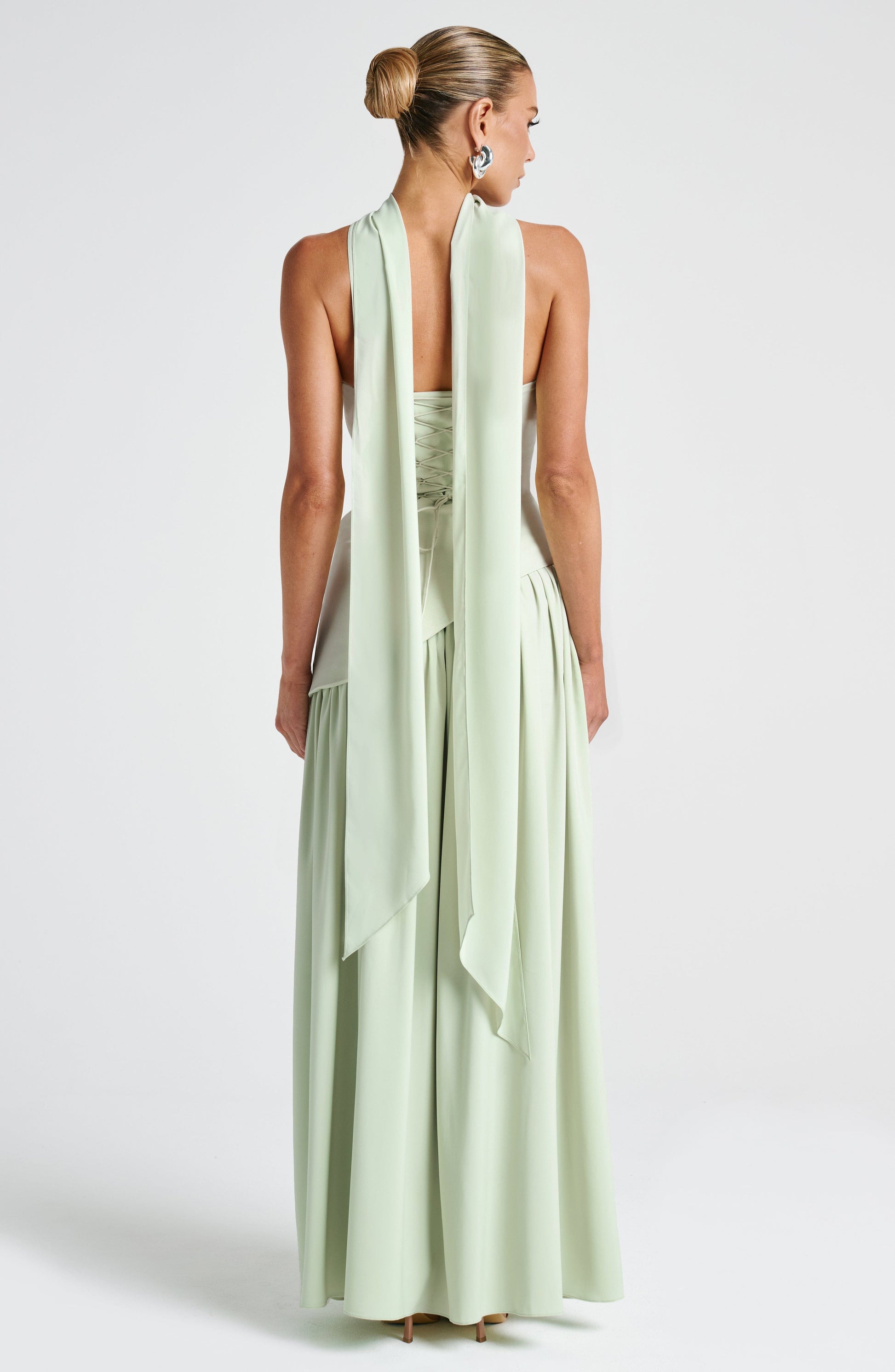 Mint strapless maxi dress with sculpted waist and chiffon scarf in back
