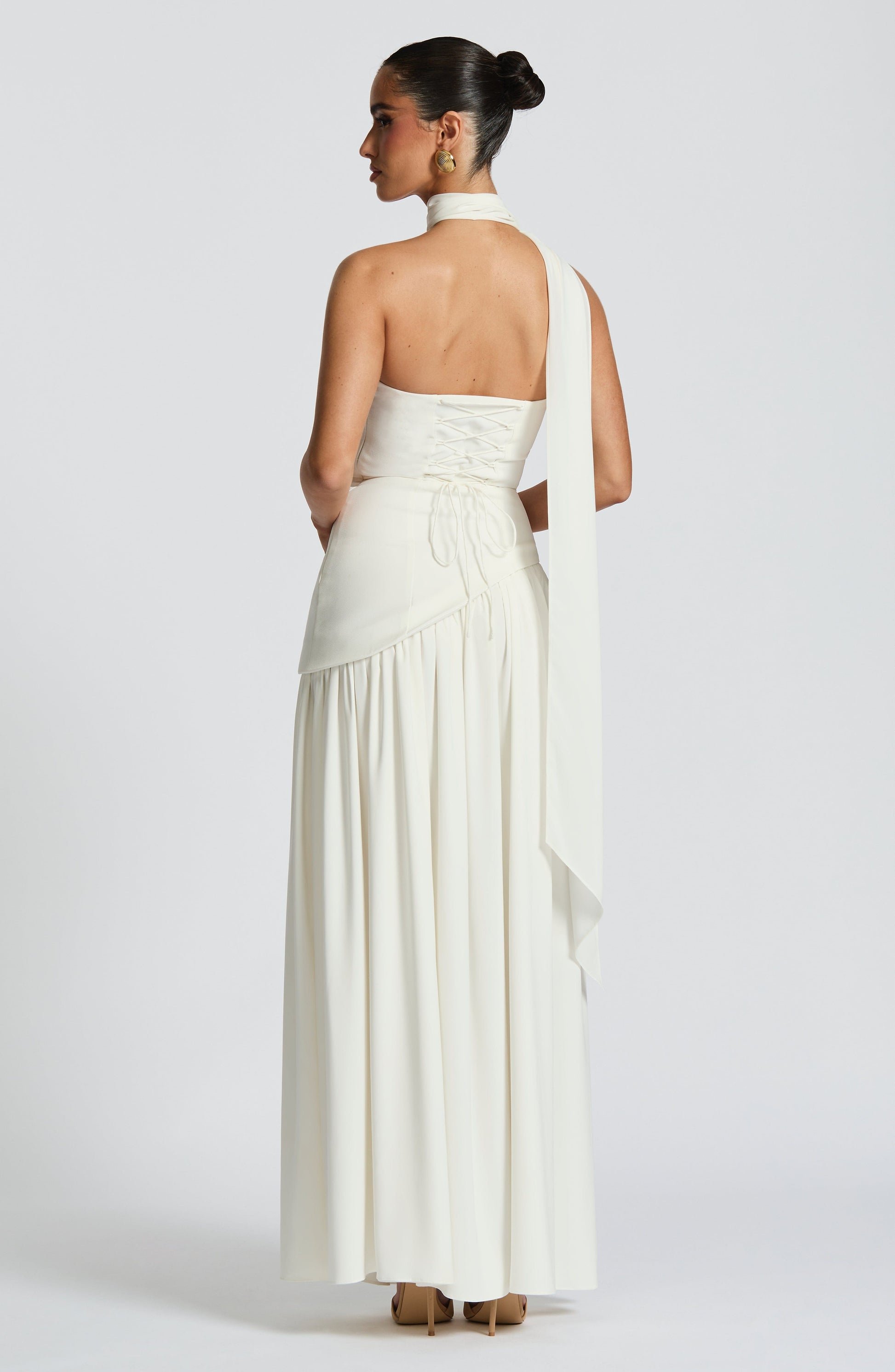 White strapless satin maxi dress with high slit and sculpted waist in back